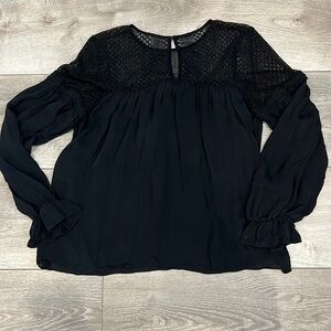 Beautiful Parker blouse with lacy top part, flouncy material.